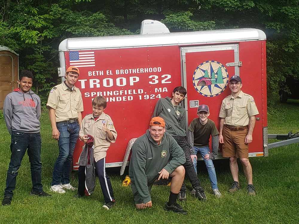 Boy Scouts in front of their troop trailer